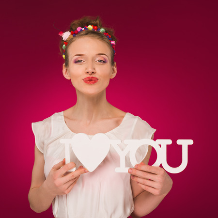 Valentines Day. I love you. Declaration of love. Girl holding the word love.の写真素材