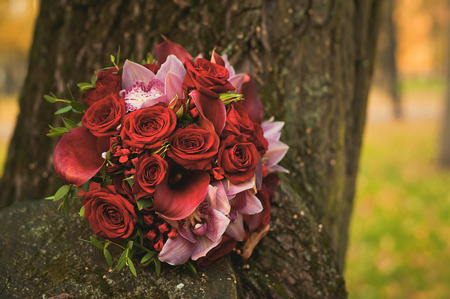 Summer wedding bouquet of delicate roses on stone background.の写真素材