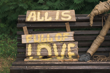 Word wedding, white letters. Caption wedding of wooden letters.の写真素材