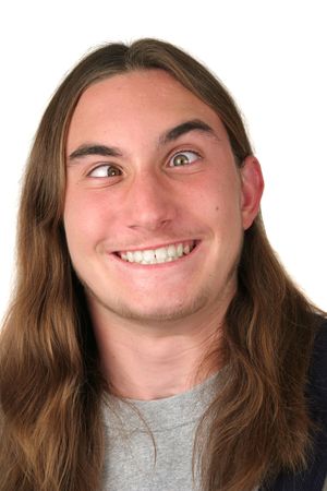 A young man making a goofy, cross-eyed face. Isolatedの写真素材