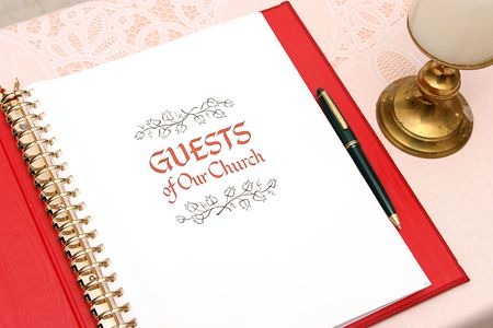a church guest book open to the first pageの写真素材