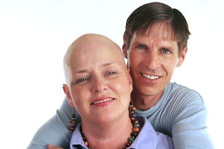 A loving, devoted couple.  The wife is undergoing cancer treatment.の写真素材