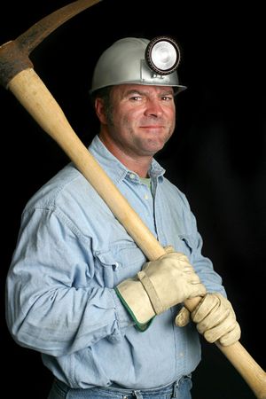A friendly coal miner with his pick ax over his shoulder.