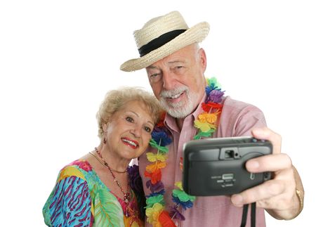 An attractive senior couple taking their picture on vacation.の写真素材