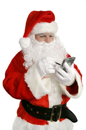 An updated Santa Claus checking his list on PDA.  Isolated on white.の写真素材