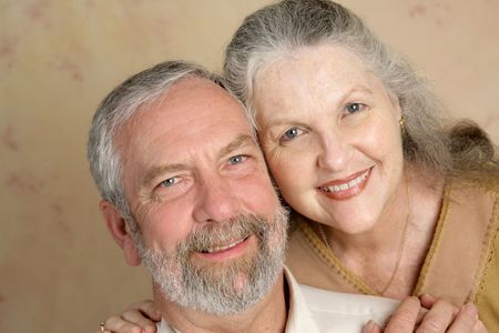 Portrait of a  beautiful gray haired middle aged couple in love.