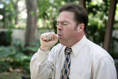 A middle aged man with a severe cough.の写真素材