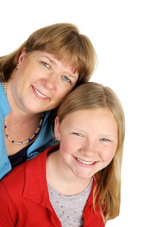 An attractive blond, blue-eyed mother and daughter.  Vertical view Isolated on white.の写真素材