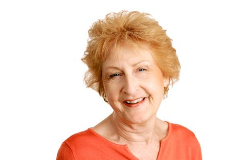 A friendly, happy red haired senior lady.  Isolated on white.の写真素材