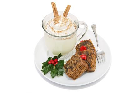 Delicious Christmas fruitcake served with a foamy mug of eggnog.  の写真素材