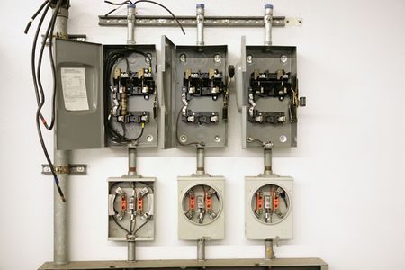 Industrial electrical meter center with multiple breaker panels.  They are disassembled to help...