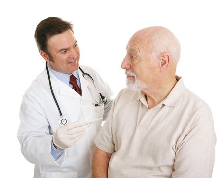 Senior man at the doctor finding out his temperature is normal.  Isolated on white.  の写真素材