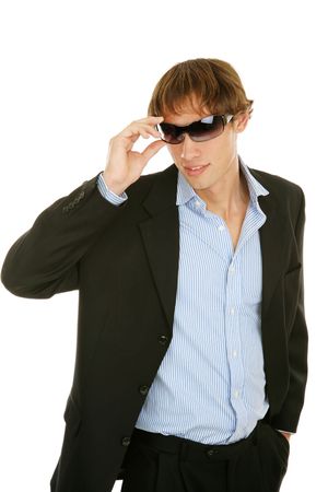 Handsome young businessman removing his sunglasses.  Isolated on white.の写真素材