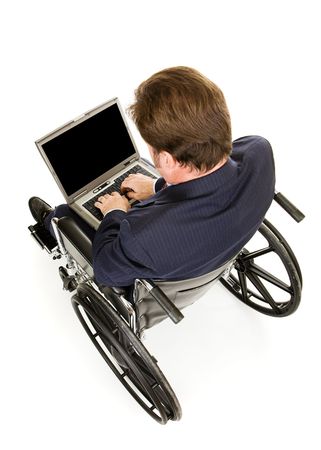 View from above of disabled businessman typing on his laptop.  Full body isolated on white with focus on the hands and computer.  Screen blank for your text. の写真素材