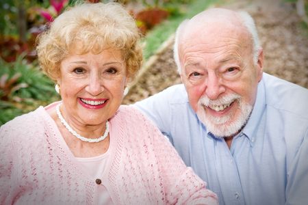 Portrait of a beautiful, happy senior couple outdoors in the garden.  