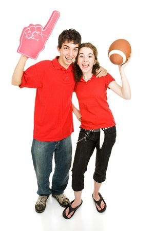 Teen couple roots for their football team.  Full body isolated on white.  の写真素材