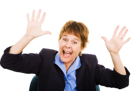 Mature business woman in a state of panic.  Isolated on white. の写真素材