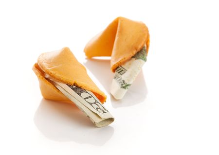 US twenty dollar bills inside Chinese fortune cookies.  Metaphor for American debt to China.  Isolated.の写真素材