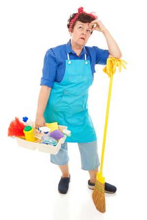 Tired, unhappy cleaning lady.  Full body isolated on white.の写真素材