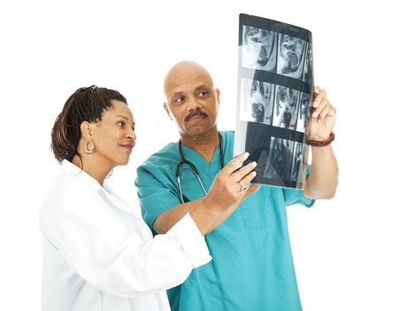 Two doctors reviewing a patient's x-ray results.  Isolated on white.  