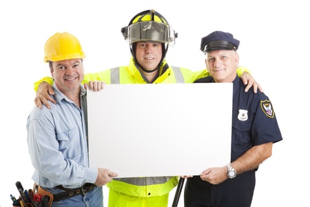 Construction worker, fireman, and policeman holding a blank white sign.  Isolated on white.  の写真素材