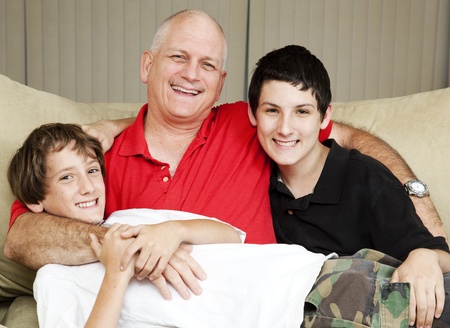 Family portrait of a loving father with his two sons.  の写真素材