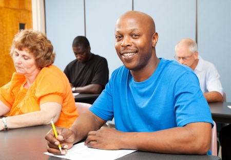 Portrait of a handsome African-american college student in adult education class. Portrait of a handsome African-american college student in adult education class.
