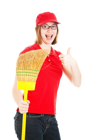 Teenage girl holding a broom, excited about her first job.  Isolated on white.  の写真素材