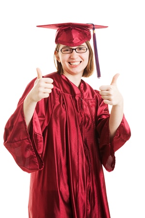 Female high school or college graduate giving thumbs up sign.  Isolated on white.  の写真素材