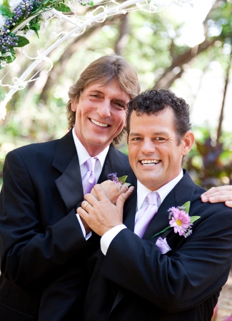 Handsome couple pose for portrait on their wedding day. の写真素材