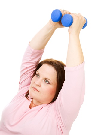 Pretty, plus size woman working out with hand weights.  Isolated on white.  の写真素材