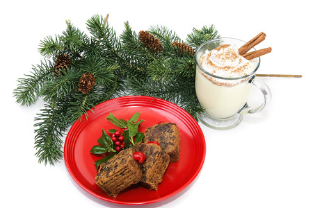 Christmas fruitcake and eggnog on white background.  の写真素材