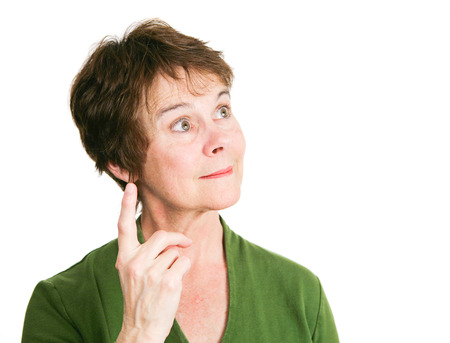Pretty middle-aged woman has a bright idea.  Isolated on white.の写真素材