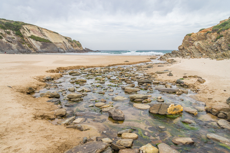 Rocks and cliffs in Zambujeira do Mar, Alentejo, Portugalの写真素材