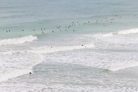 Surfers in Costao do Santinho beach, Florianopolis, Santa Catarina, Brazilの写真素材