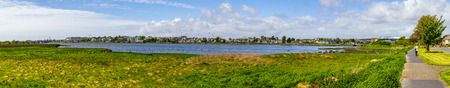 Lough Atalia bay with houses in background, Galway, Ireland