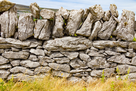 Stone wall and vegetation in Ballyvaughan, Irelandの写真素材