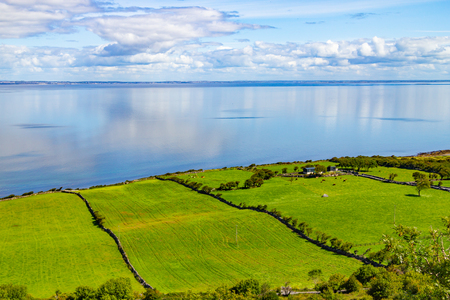Farms and beach in Ballyvaughan, Clare, Irelandの写真素材