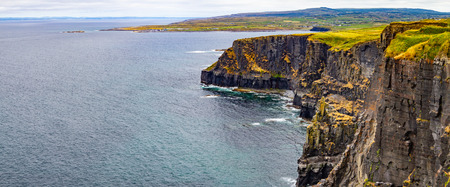Panorama of Cliffs of Moher with Doolin village and farm fields in background, Clare, Irelandの写真素材