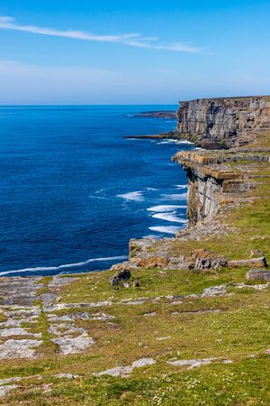 Cliffs, Rocks, vegetation and ocean in Inishmore, Aran Islands, Irelandの写真素材