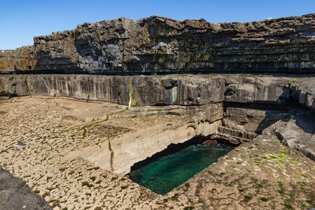 Cliffs and worm hole in Inishmore, Aran Islands, Irelandの写真素材