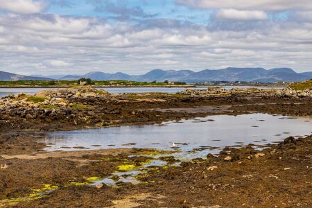 Bay with low tide and mountains in Carraroe, Conemara, Galway, Ireland