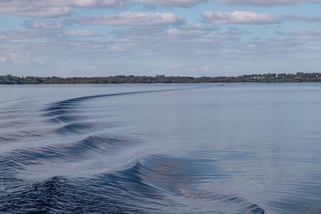 Boat waves, Clouds and reflections in Lough Corrib lake, Cong, Mayo, Irelndの写真素材