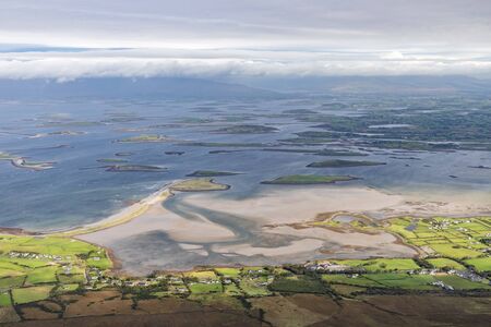Westport bay and islands with farms and beaches taken from Croagh Patrick mountain, Westport, Irelandの写真素材