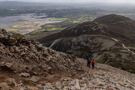 Trail, Rocks and valley at Croagh Patrick mountain with Westport in background, Westport, Irelandの写真素材