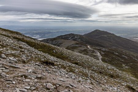 Trail, Rocks and vegetation at Croagh Patrick mountain with Westport in background, Westport, Irelandの写真素材