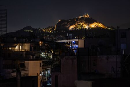 Lights of Athens city with Lycabettus mountain at sunset, Athens, Greeceの写真素材
