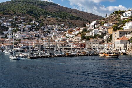 Boats and buildings around pier in Hydra Island, Greeceの写真素材