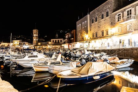 Night lights of Boats and buildings around pier in Hydra Island, Greeceの写真素材