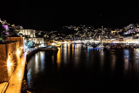 Night lights of Boats and buildings around pier in Hydra Island, Greeceの写真素材